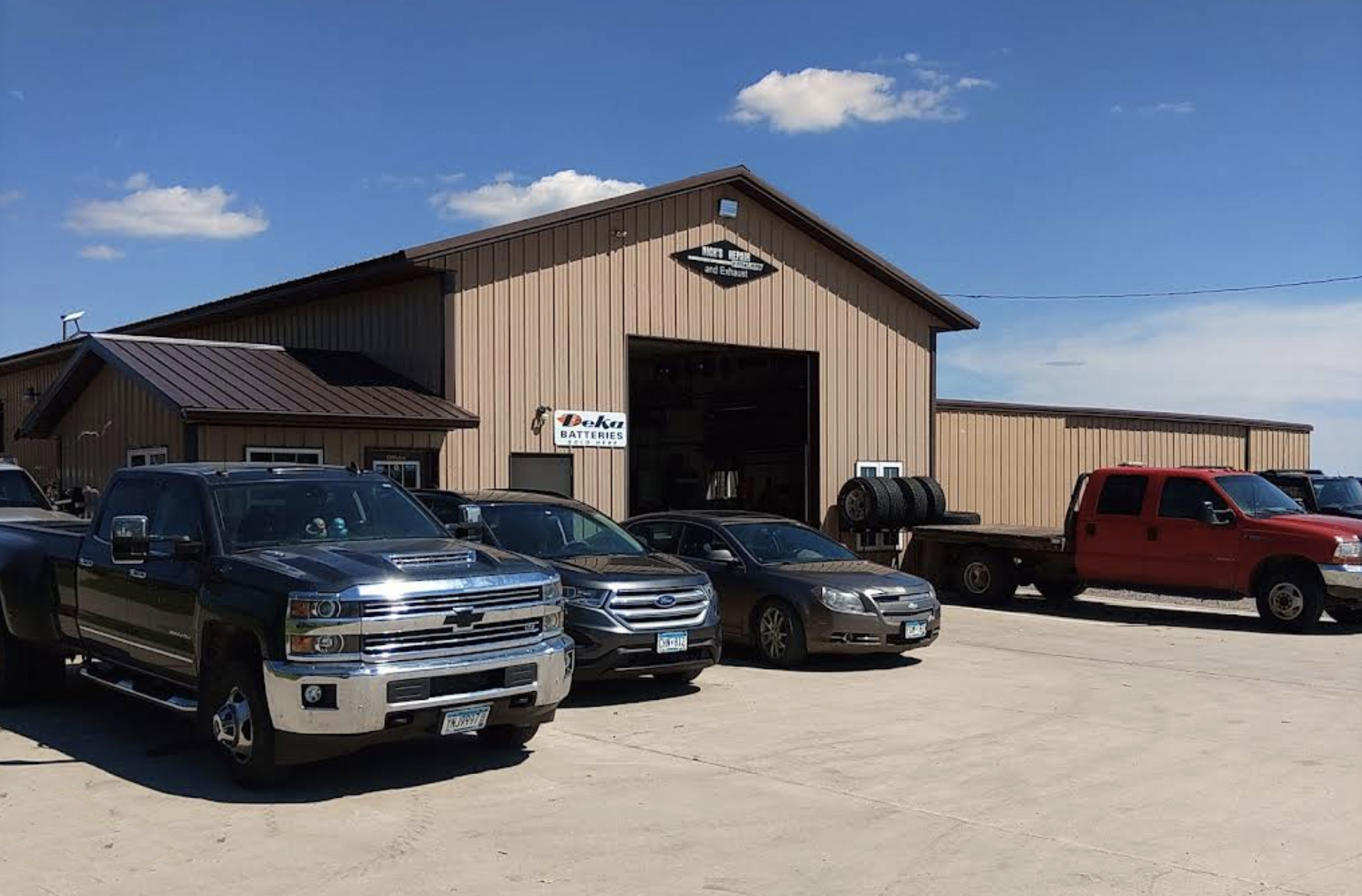 Vehicles parked outside Nick’s Repair & Exhaust in Osakis