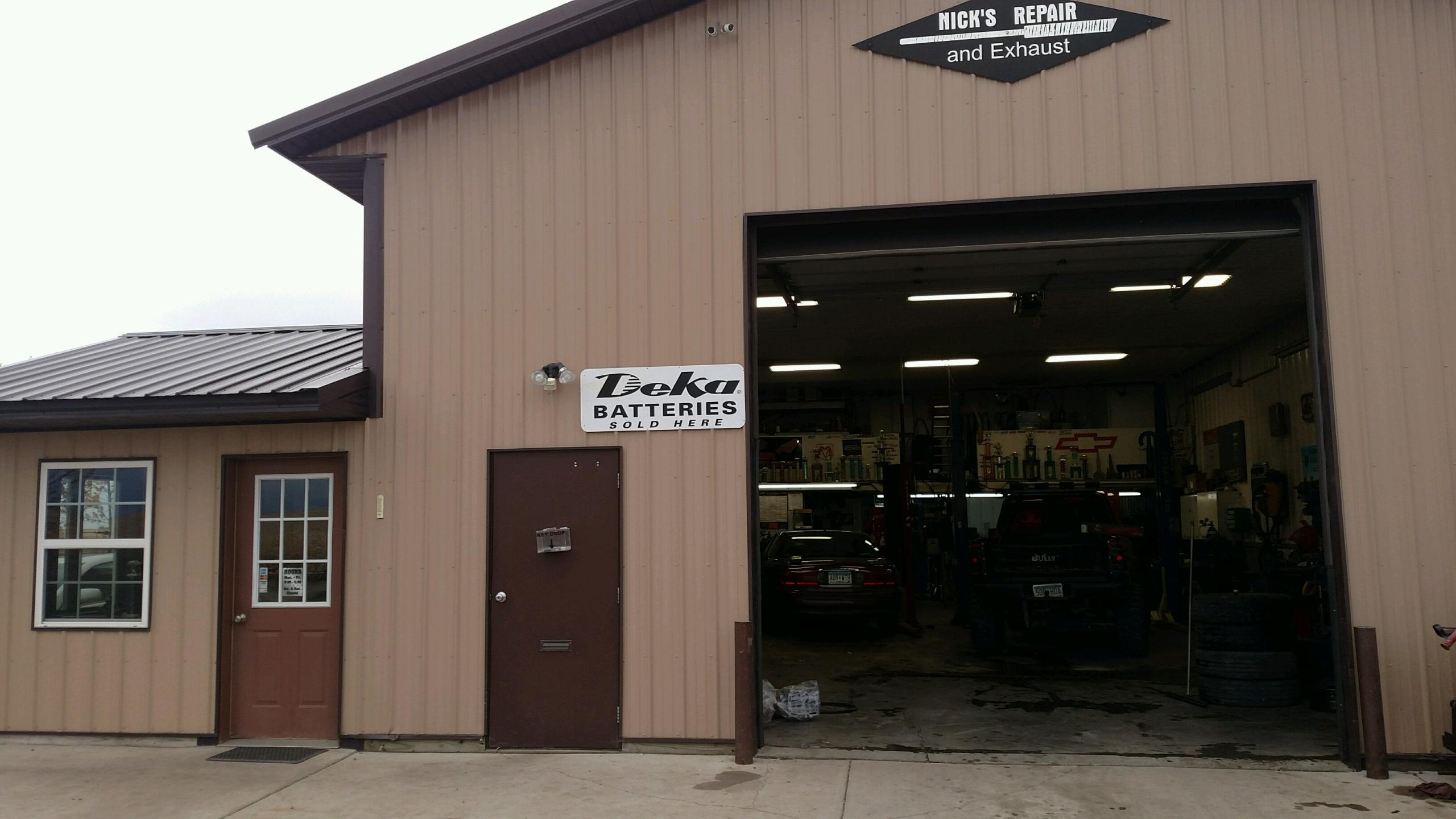 The front entrance and open service bay at Nick’s Repair & Exhaust in Osakis